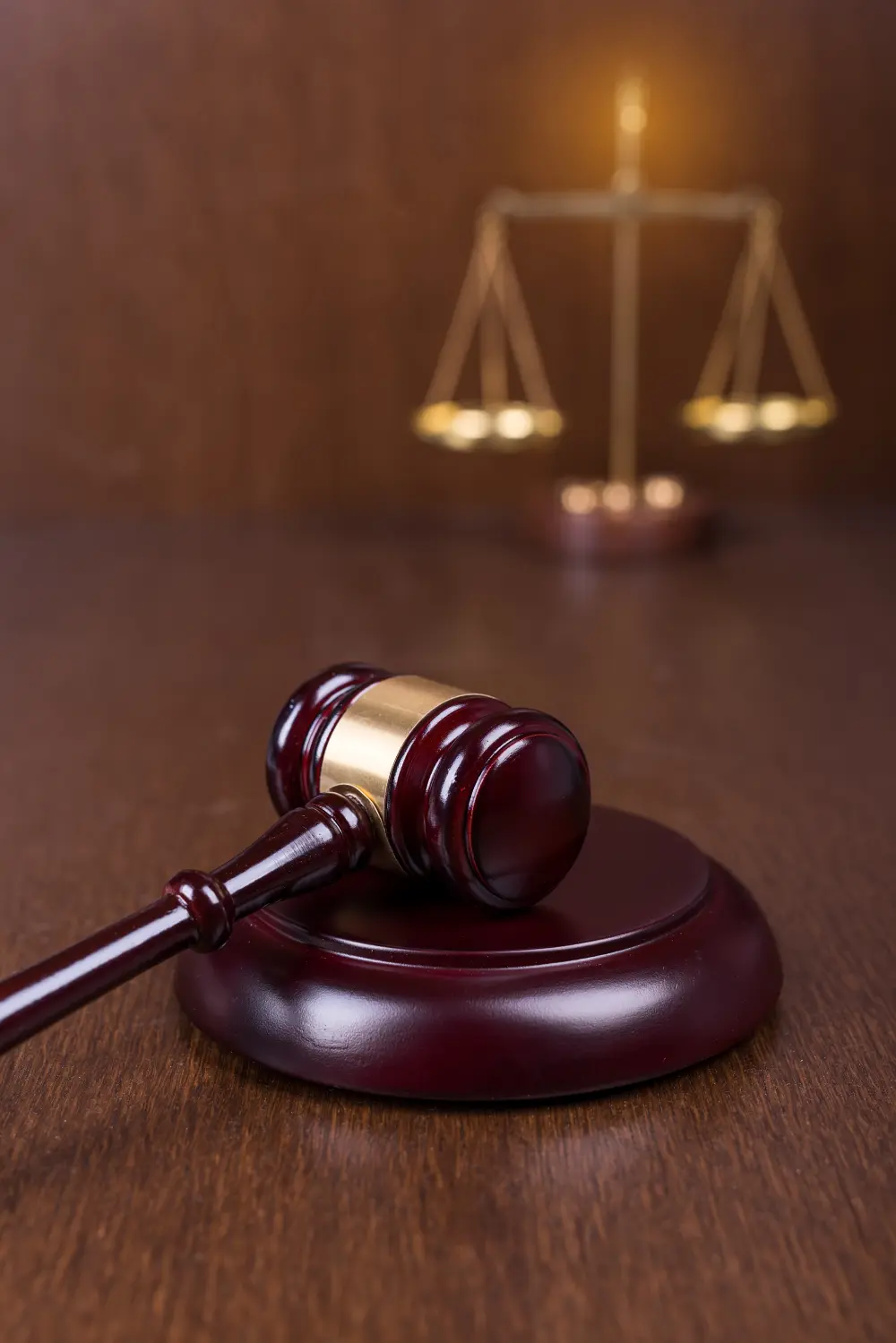 Gavel in front of Scales of Justice.
