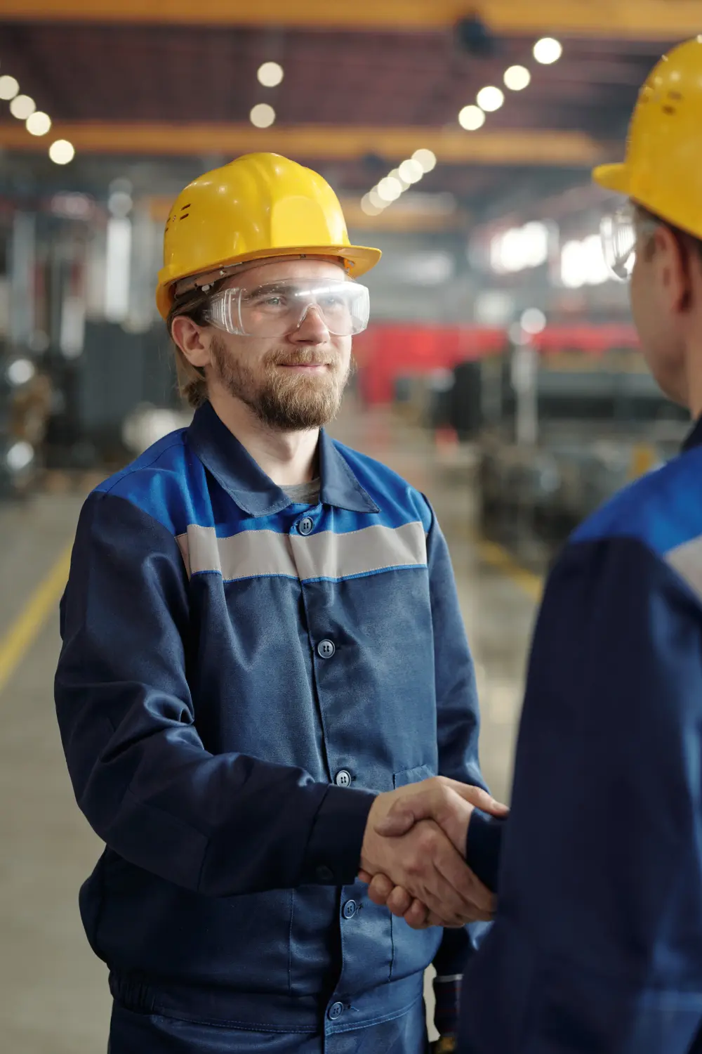Tradie shaking hands with project manager.